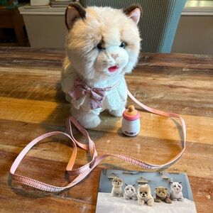 Battery powered Cat Toy that walks, miaus/talks, drinks milk and shakes tail.